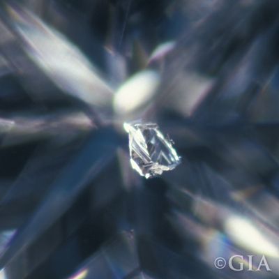 A photo of a knot. A type of diamond inclusion that looks like a crystal.