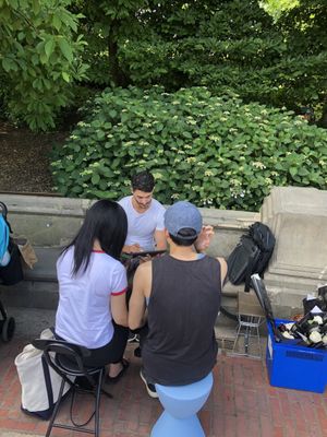 Artist Zac Karis drawing a couple at Frank Darling's 30 Second Love Stories Event at Central Park, Bethesda Fountain.