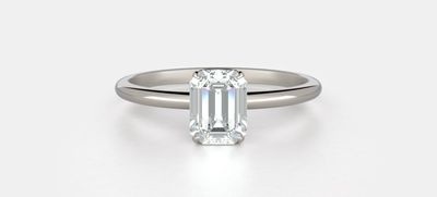 Harper No. 2 in white gold - a four prong set emerald. Set this celeb inspired engagement ring with a lab-grown diamond for the perfect look.