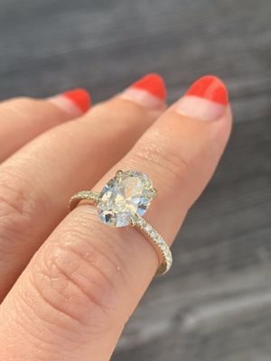 Custom oval solitaire engagement ring with pave band