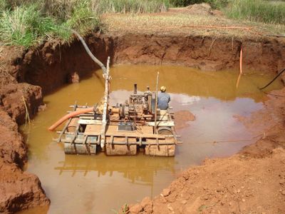 Alluvial miners dredging a river to find diamonds. A practice some consider to produce sustainable diamonds.
