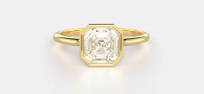 An Asscher solitaire compared to an emerald solitaire to help answer the question: Emerald vs. Asscher