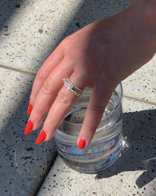 Ring stack featuring our 1/2 carat eternity band, and baguette channel band