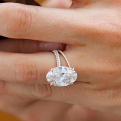 Blake Livelys Oval Engagement Ring in rose gold with a diamond pave band