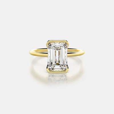 Mason No. 2 by frank darling featuring a 2 carat emerald cut diamond set in a yellow gold half bezel ring setting