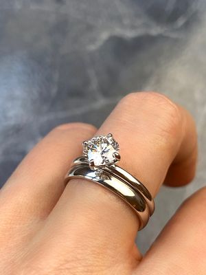 Frank darling custom 2.5mm semi round platinum band paired with a compass point solitaire setting
