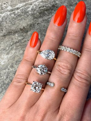 custom frank darling engagement rings on a hand