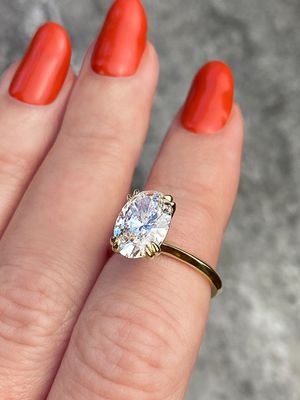 frank darling oval diamond engagement ring with double claw prongs in yellow gold