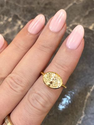 Frank Darling custom fancy yellow oval diamond bezel ring.