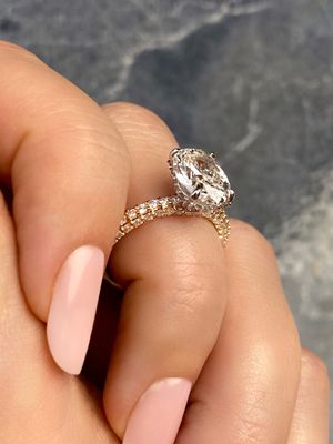 Two-tone oval rose gold engagement ring with micropavé