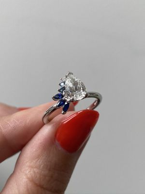Frank darling custom pear diamond and sapphire engagement ring.