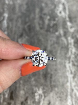 Custom Frank Darling round diamond and sapphire accent engagement ring.