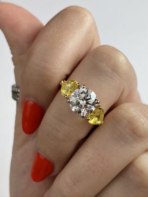 Frank Darling custom three stone with yellow sapphire heart shaped side stones