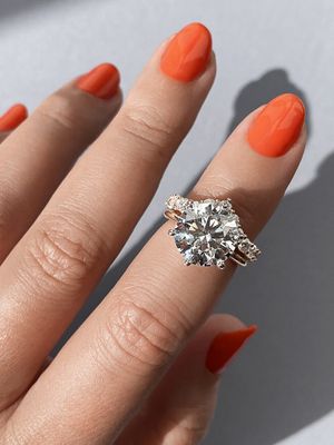 Frank Darling's best mixed metal ring stacks 5 carat round diamond with matching band.