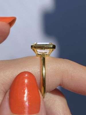 Frank darling custom open gallery emerald bezel in yellow gold.