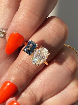 Frank darling custom toi et moi sapphire and oval diamond engagement ring.